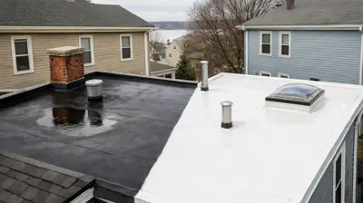 EPDM rubber roof and white TPO flat roof installed on a Rhode Island residential low-slope roof section.