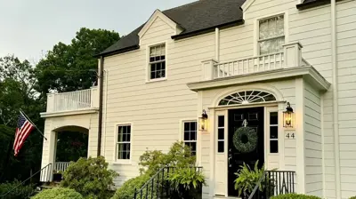 Home facade with matching siding, trim, and accent colors