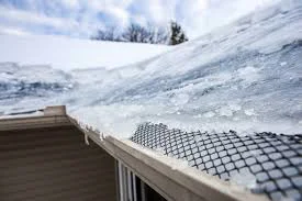 Ice dam formation and resulting water damage on a 1960s ranch home in the Barths neighborhood of Wheat Ridge, CO